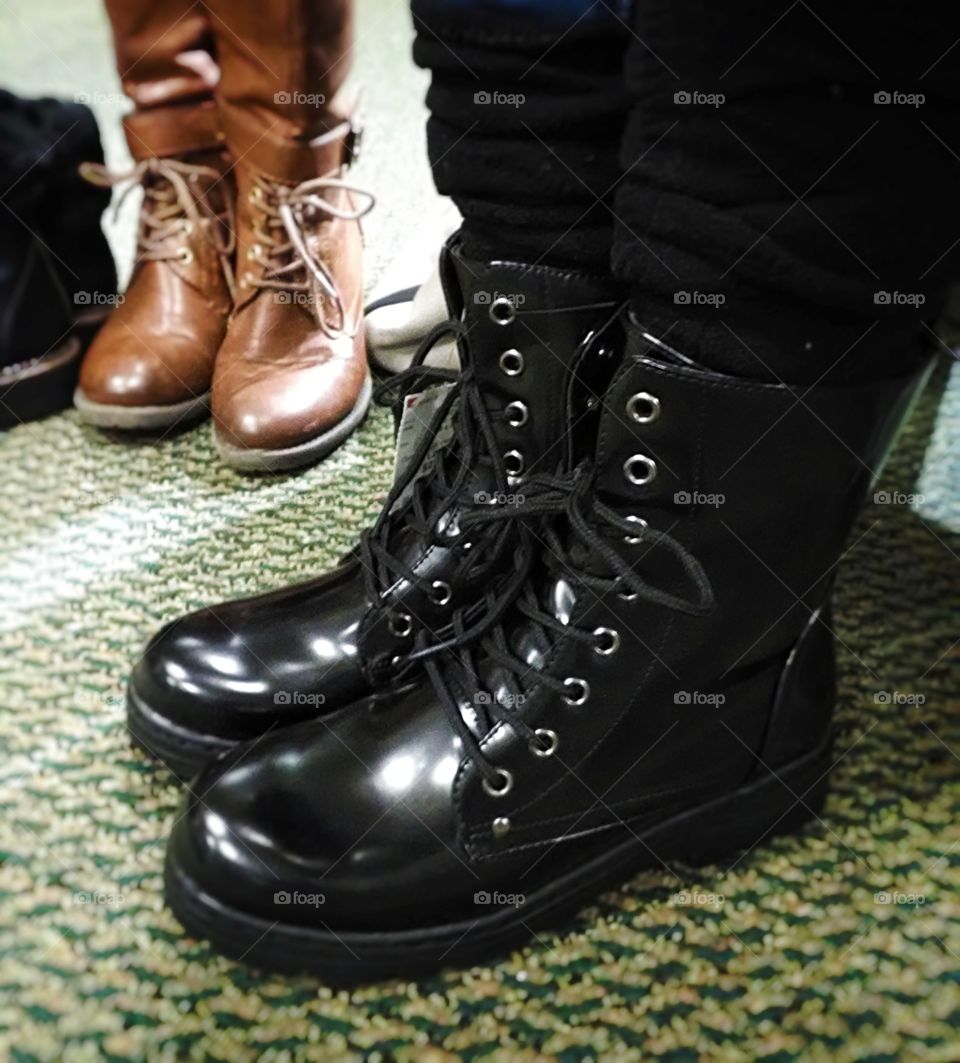 Pairs of boots standing around