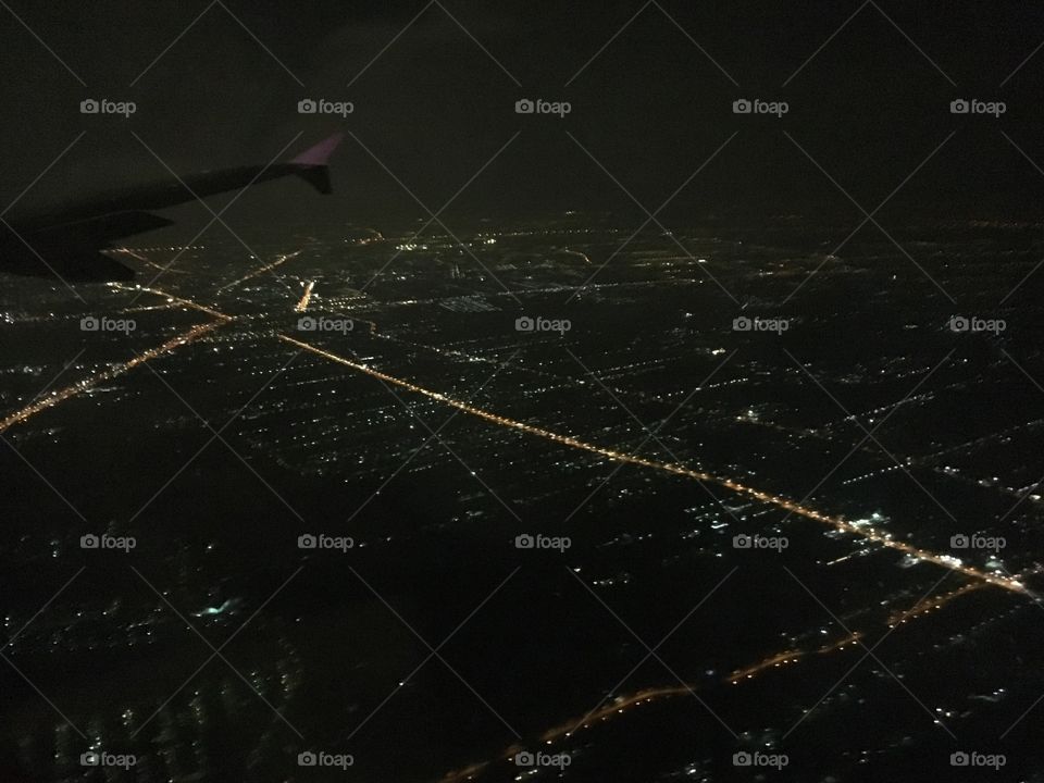  view on plane 
City 
Night lights 