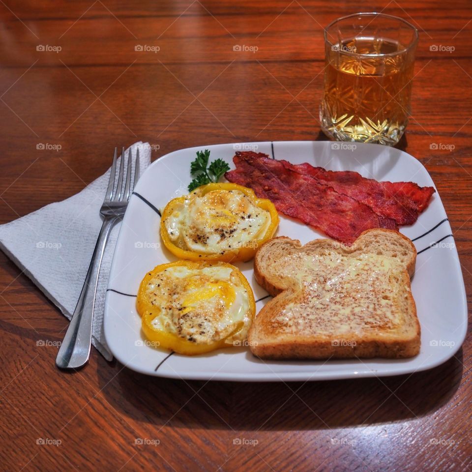 Close-up of bread with bacon in plate