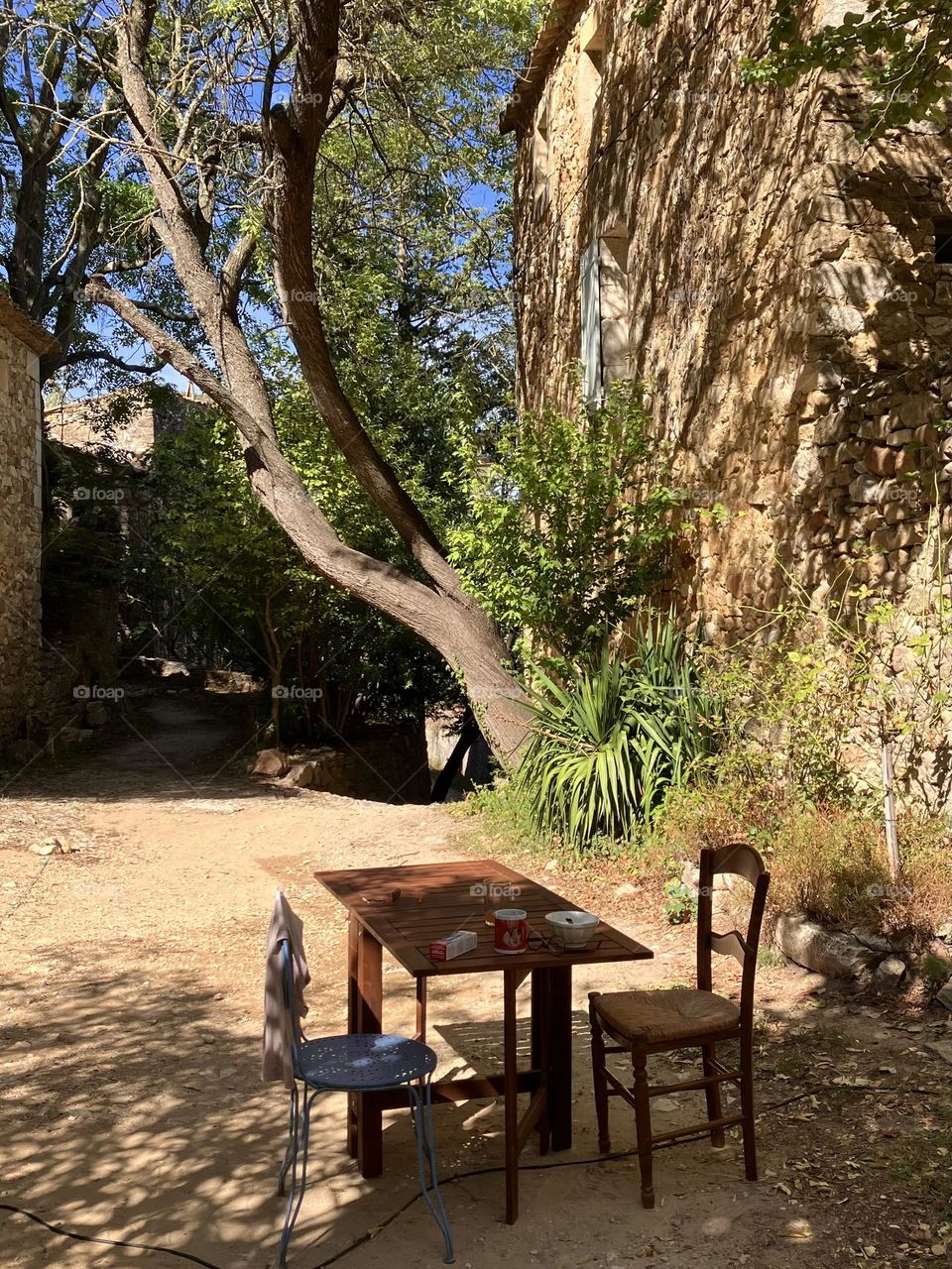 Just one table and two chairs near the house 