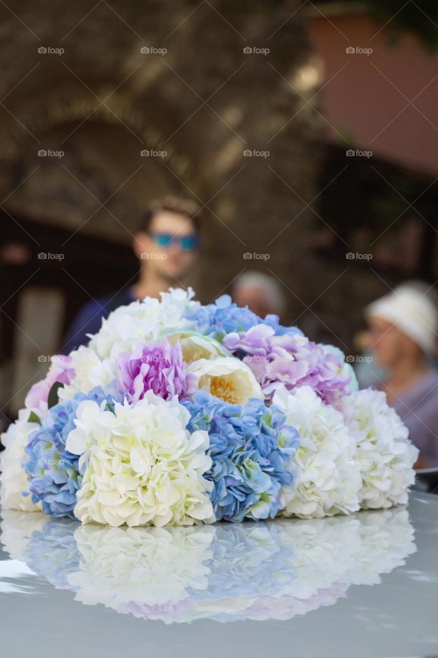 Beautiful wedding bouquet on the ceiling of the car