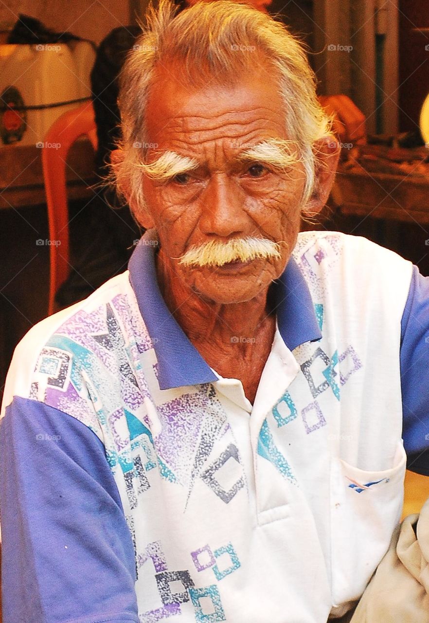 a grandfather was looking at his grandson when I photographed him