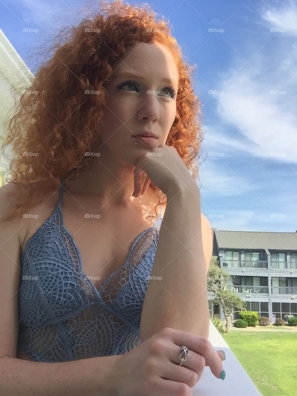 Redhead with thoughts in the sky 