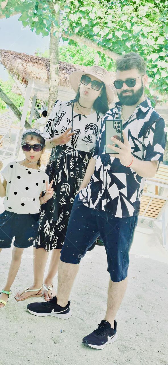 A striking family portrait radiating unity and timelessness.Our coordinated attire symbolises our close-knit bond with each member bringing a unique energy to the scene.This snapshot is highlighting our passion for video making journey.