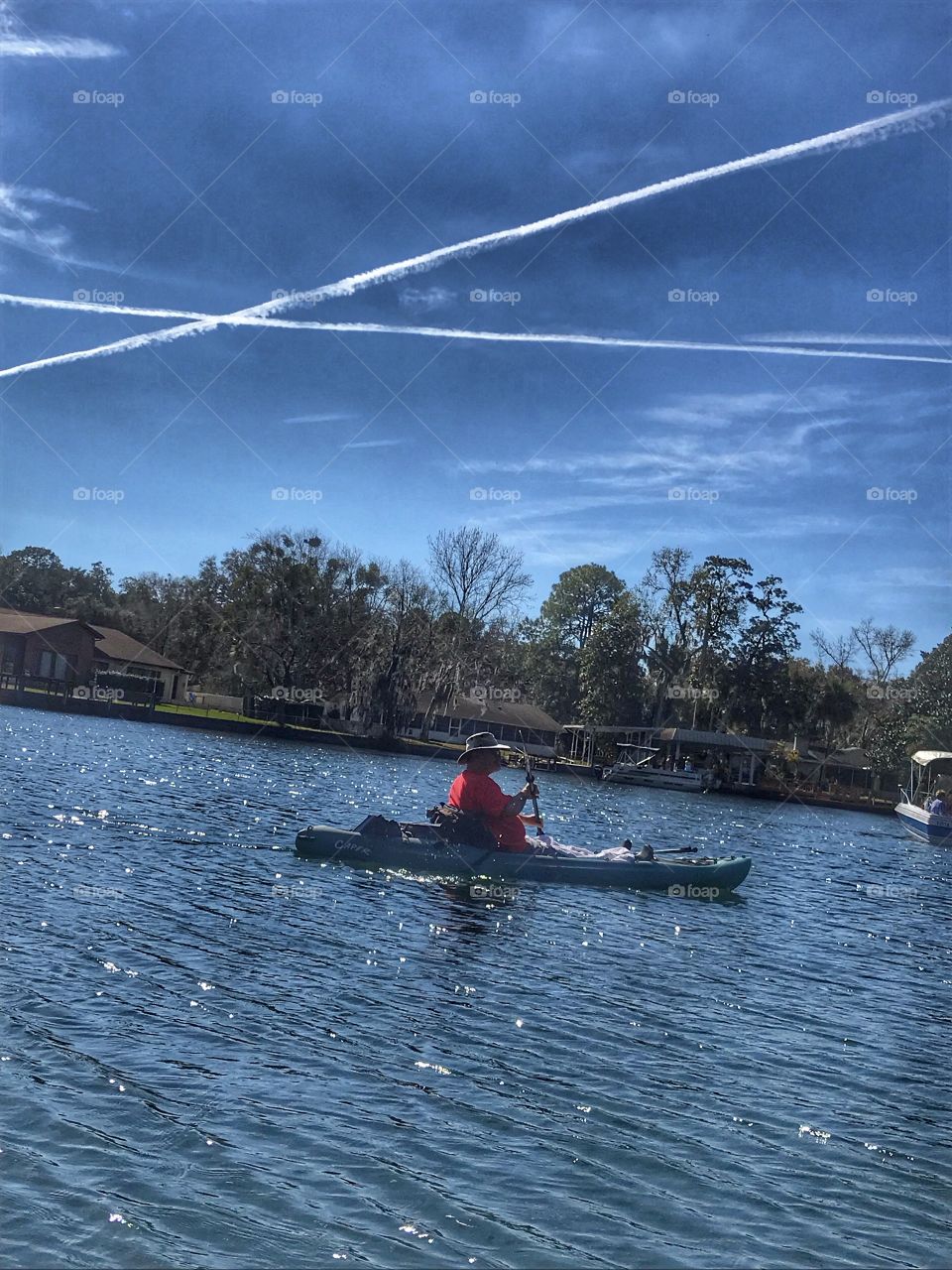 Kayaking in the river under the sun and the “X”