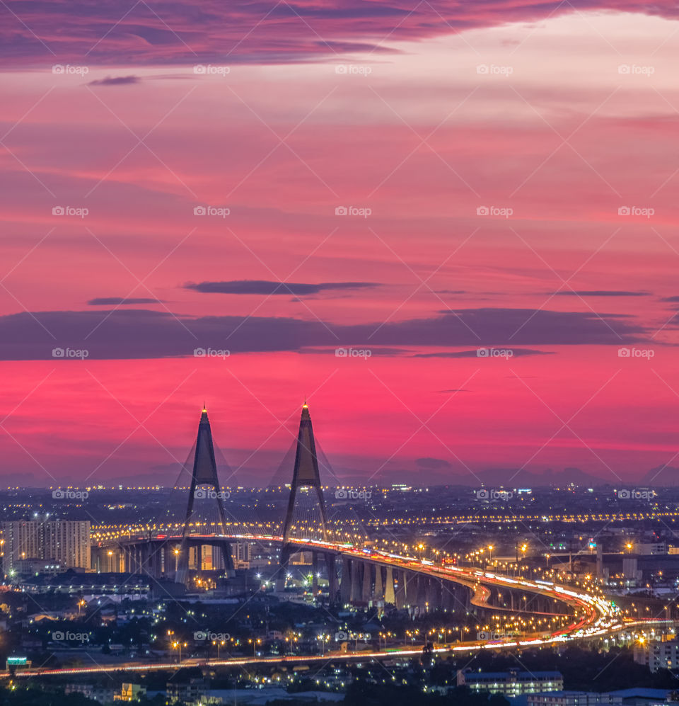 Beautiful pink sky in twilight moment above the famous landmark Bhumibol bridge in Thailand