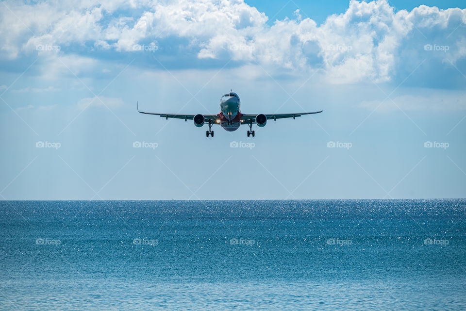 Air plane landing in the beautiful sea scape view in the southern of Thailand