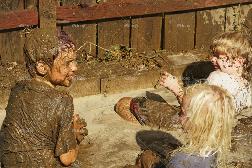 Boys Playing In Mud