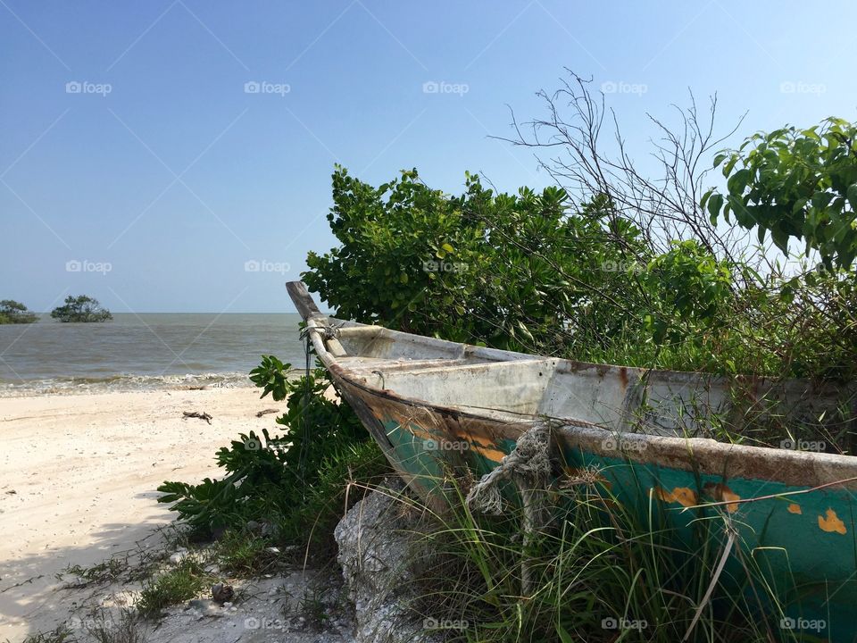 Broken boat at abandoned beach