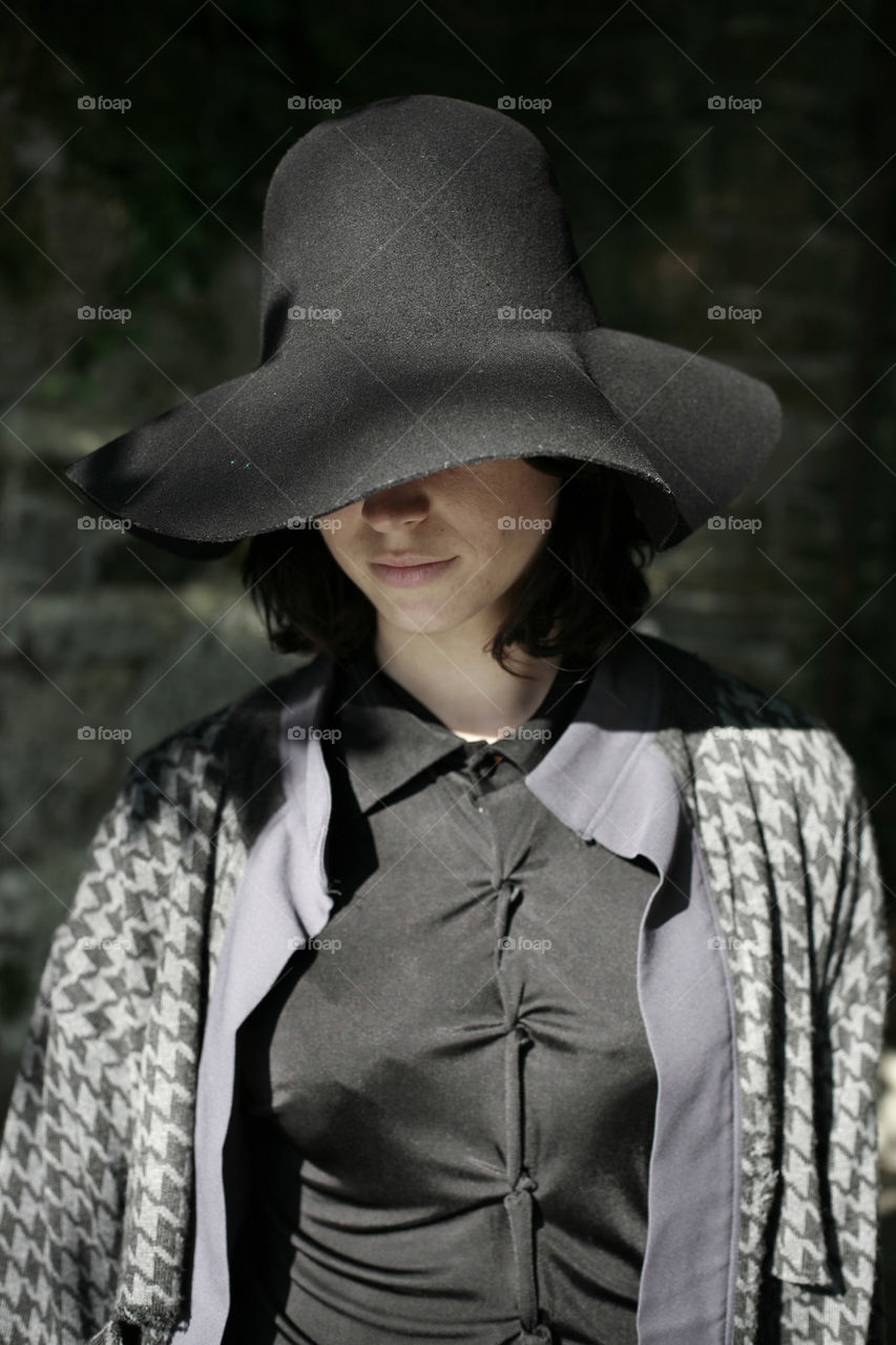 woman in black with black hat