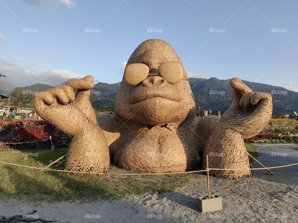 Straw weaving monkeys in the park