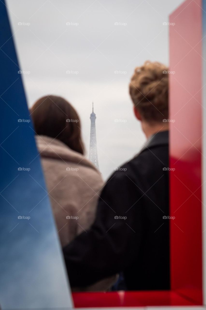 Paris with love in front of the Eiffel Tower from the rooftop of the Galeries Lafayette 
