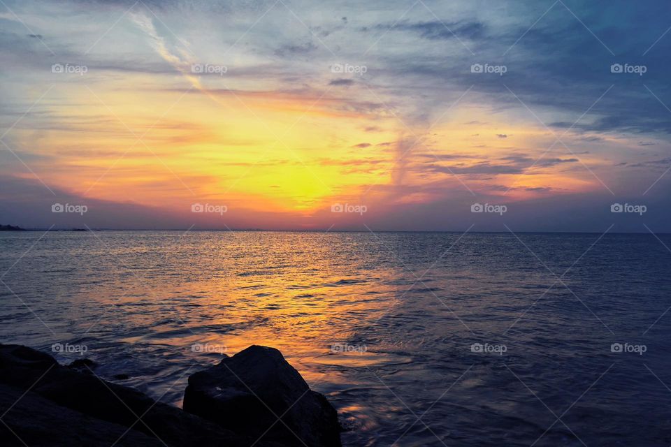 Natural photography - First beam of sun rise on the water surface of ocean 