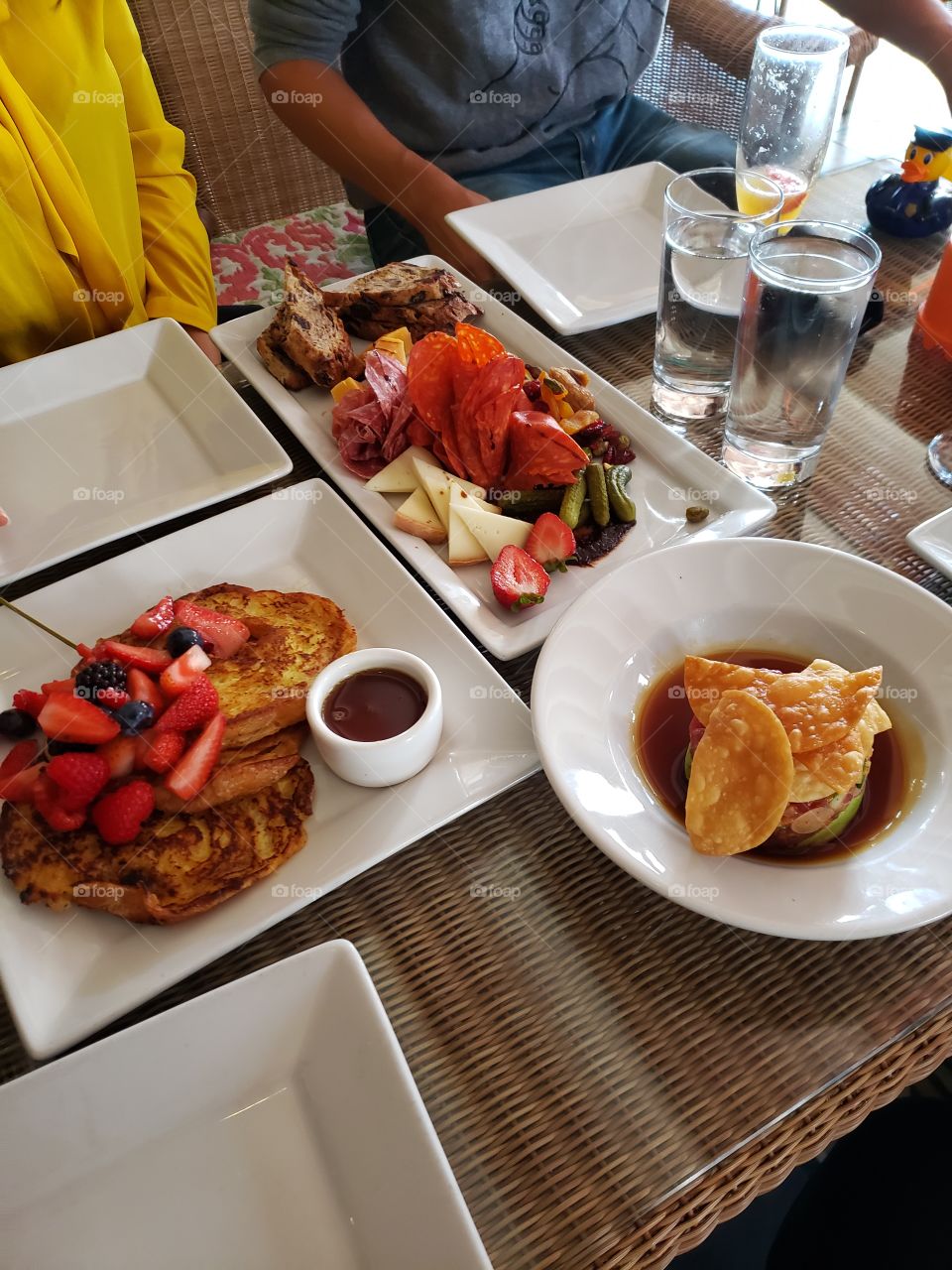 Brunch in Los Angeles. French toast, cheese charcuterie board and tuna tartar