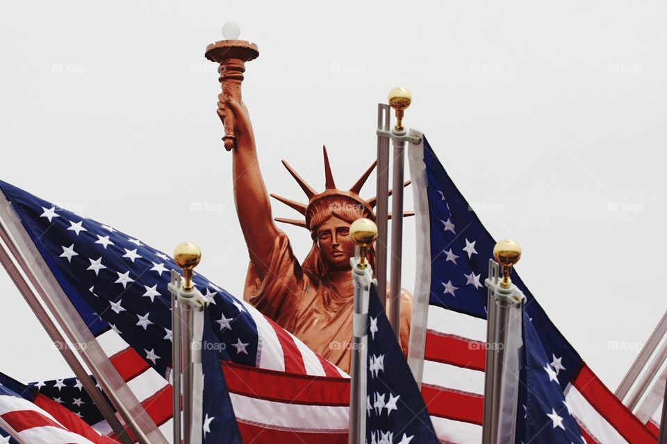 Us flags and Statue of Liberty 