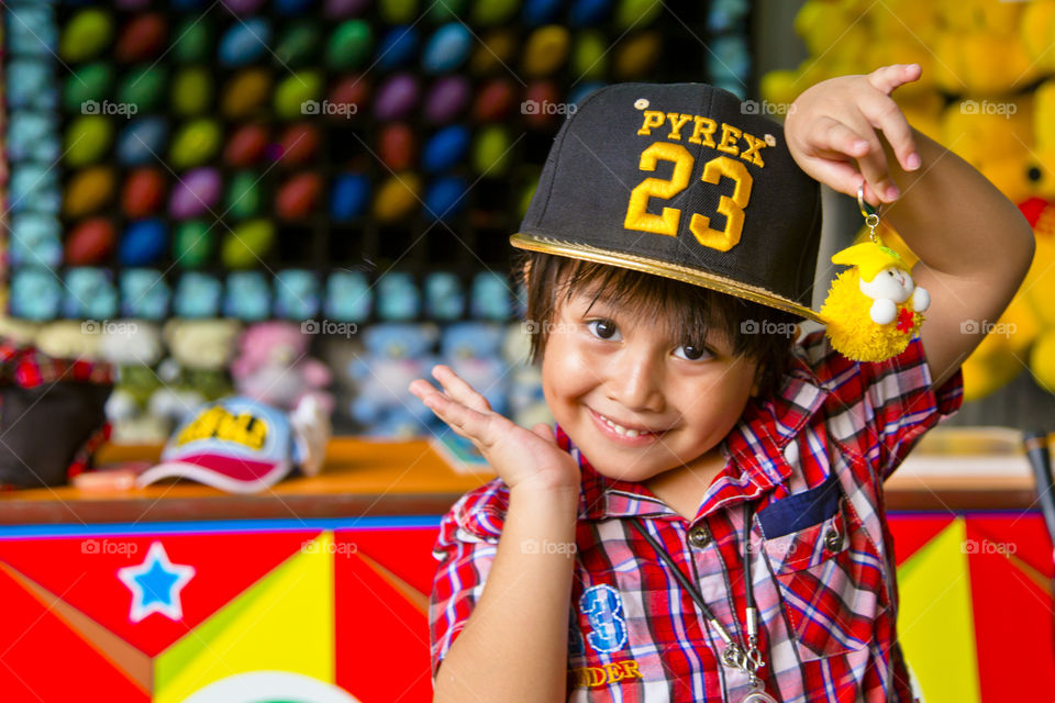 Happy kid. winning toy at the funfair