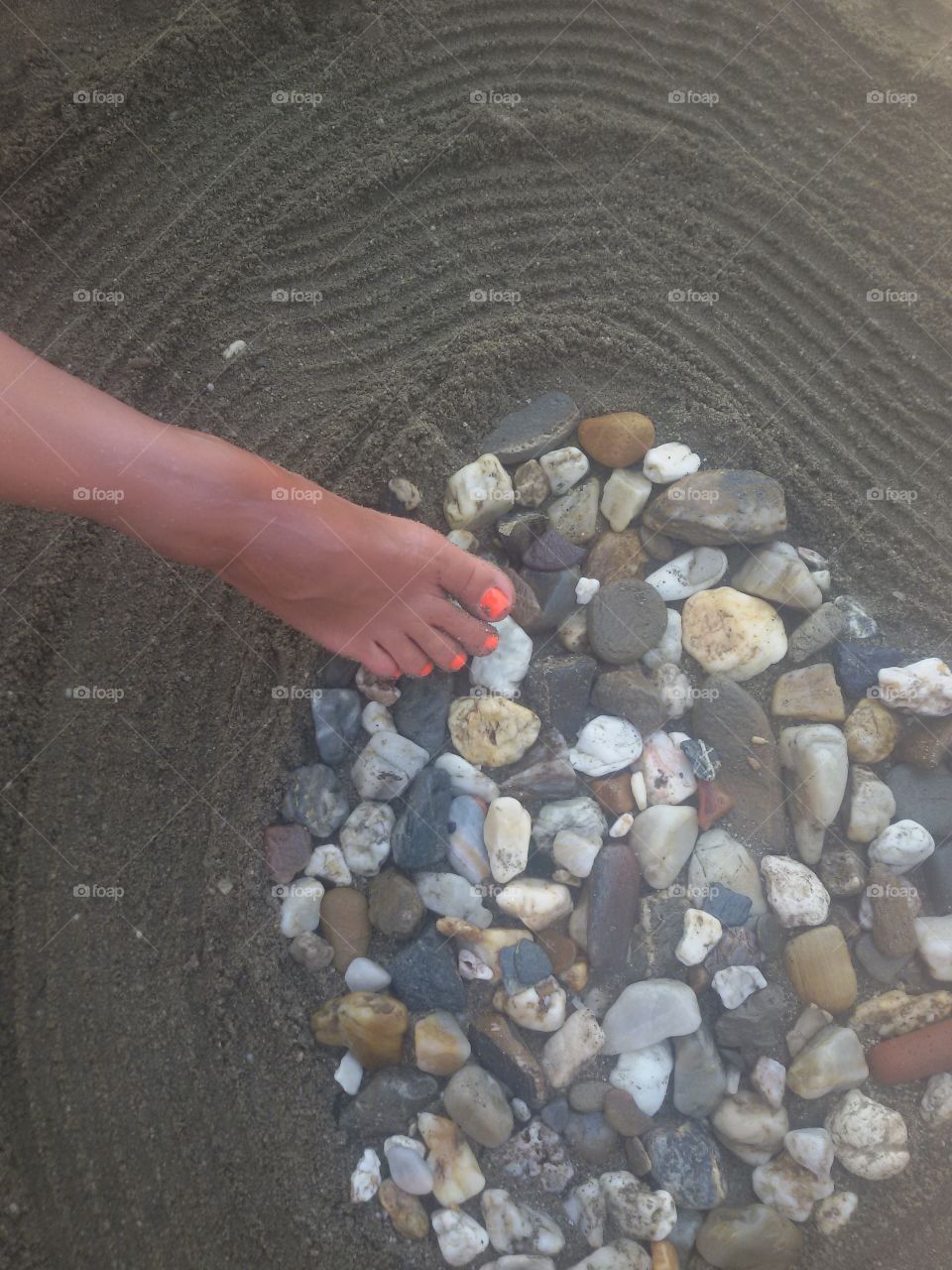 Woman leg on the beach