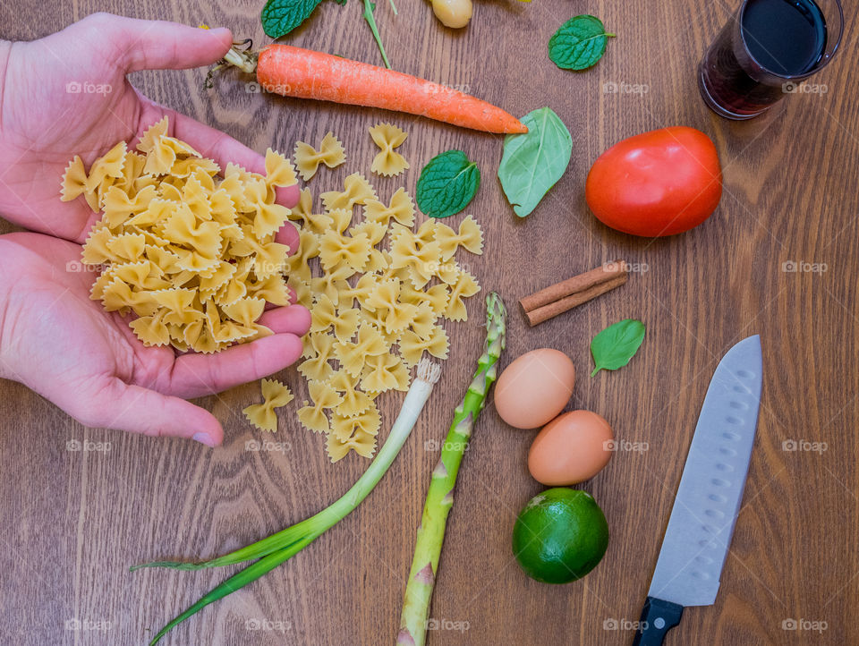 Person holding pasta