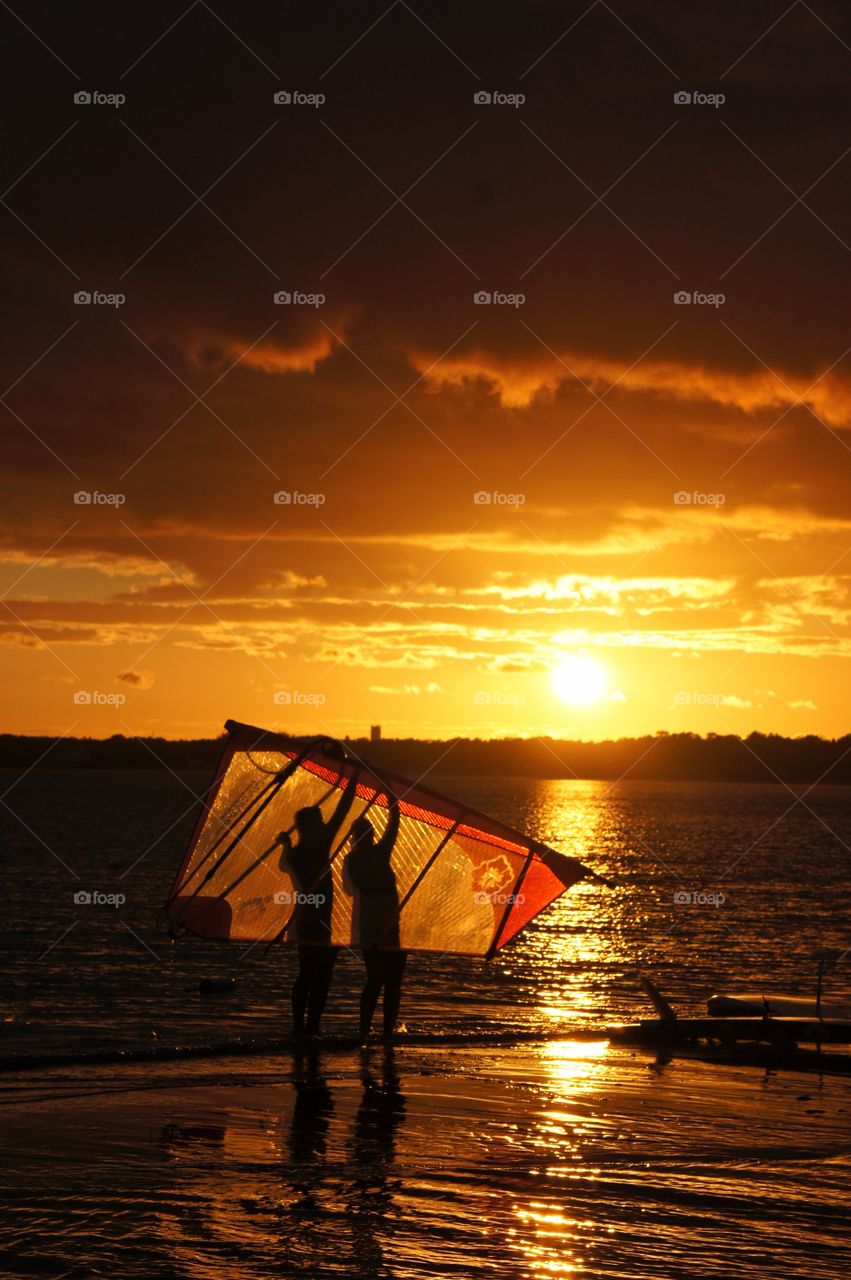 Windsurfers in reflection 