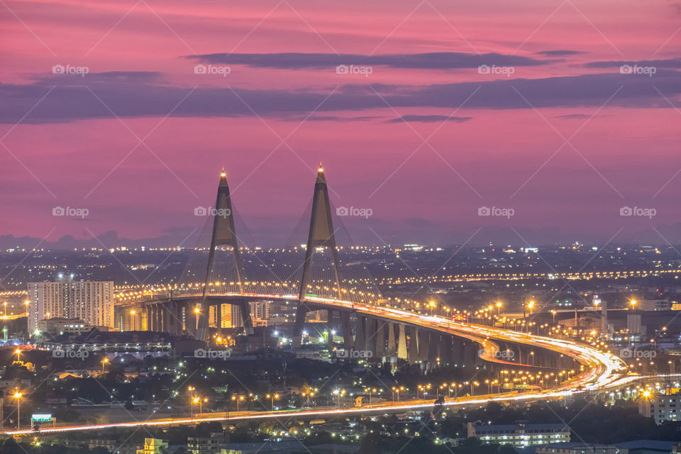 Beautiful pink sky in twilight moment above the famous landmark Bhumibol bridge in Thailand