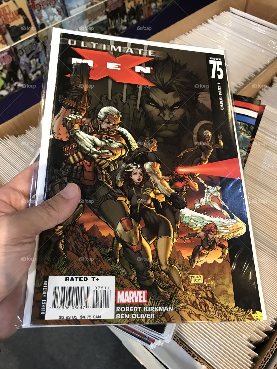 An ULTIMATE X-MEN comic. This back issue of the title is one of the countless issues of various comics being marketed at a local comic store.