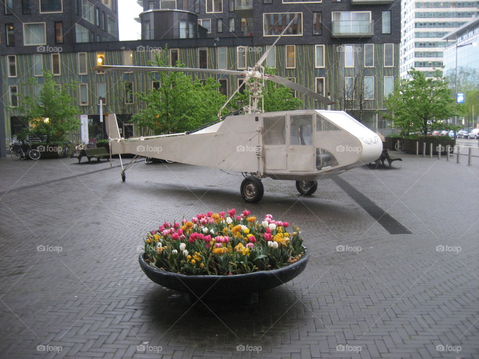 Old Helicopter. Art helicopter on square