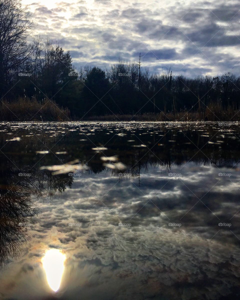 Snow moving in over the pond