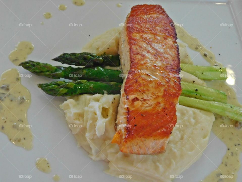 Meals and snacks of the world - A delicious salmon steak dinner - World snacking is a way of life. foods are typically designed to be portable, quick, and satisfying. Chocolate, fresh fruit, and vegetables are the most common foods and meals