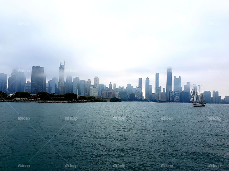 View of foggy downtown Chicago and The Tall Ship Windy from Lake Michigan