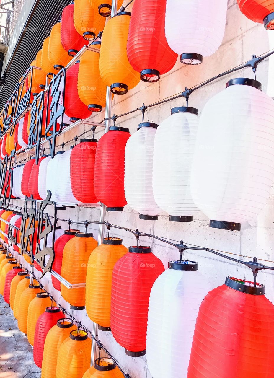 The colorful lanterns decoration on the wall.