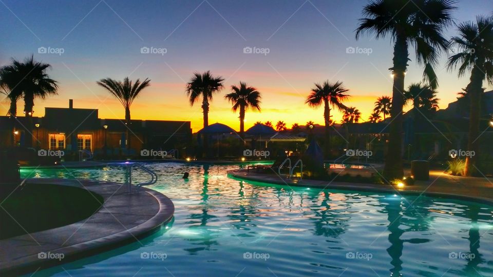 sunset over a pool