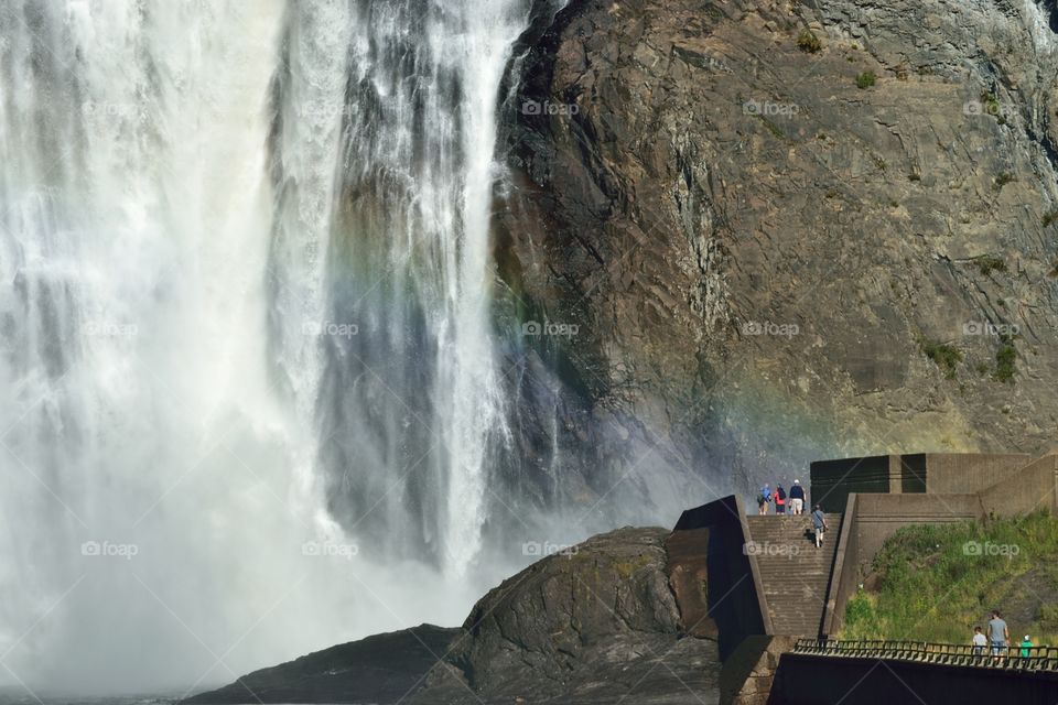 Montmorency falls, Quebec 
Waterfall with some very small looking people and a rainbow.