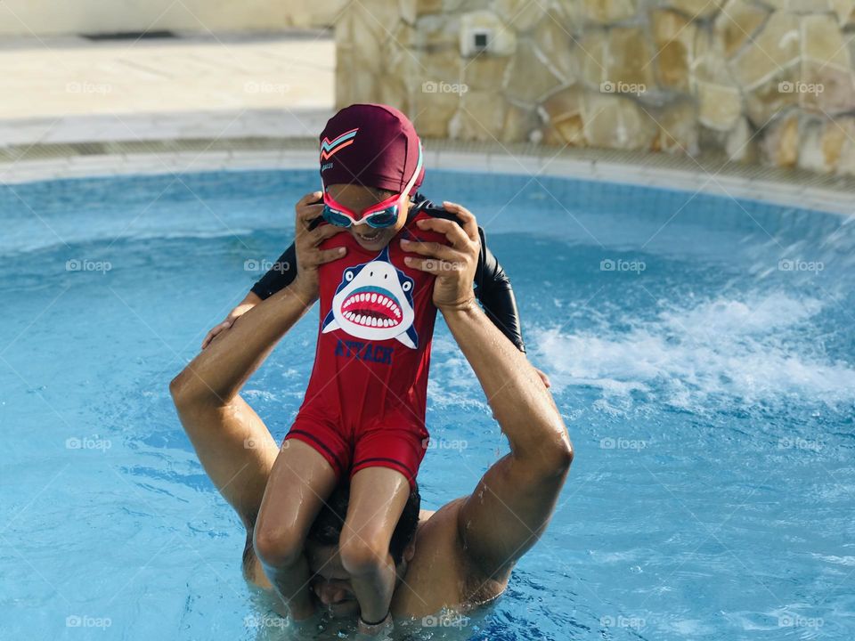 A father and daughter at swimming pool 🏊‍♀️