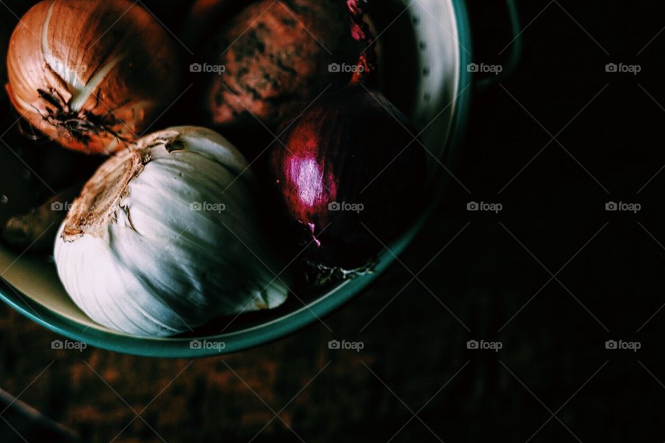 Dark picture of root vegetables on a wooden table