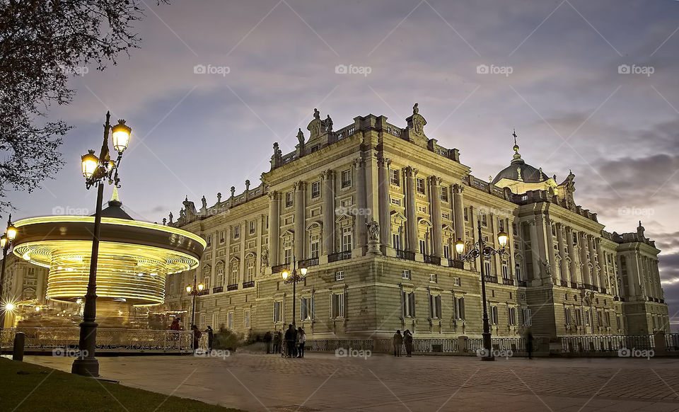 Illuminated carousel close to the royal palace in Madrid 