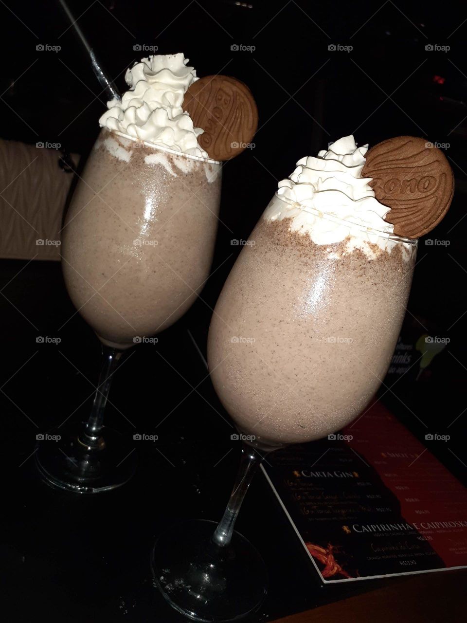 Drink with whipped cream and bono biscuits