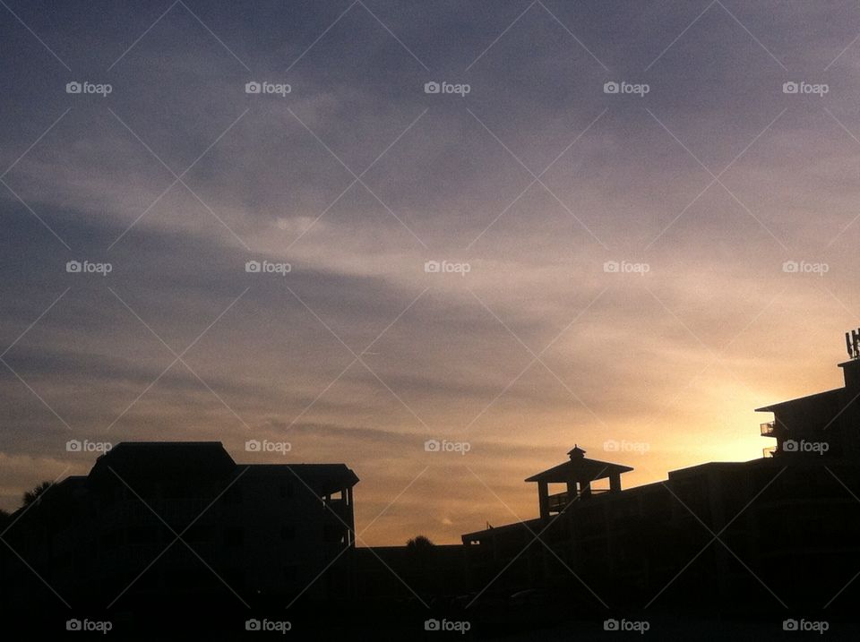 Silhouette of buildings in front of sunset
