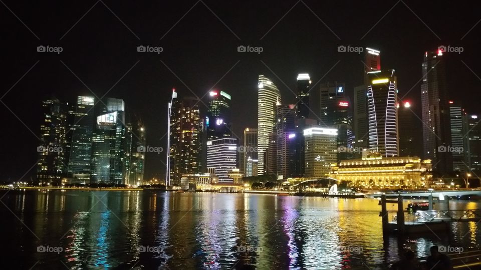 Spectacular night view of Singapore city. Fullerton hotel, city Centre, Merlion.