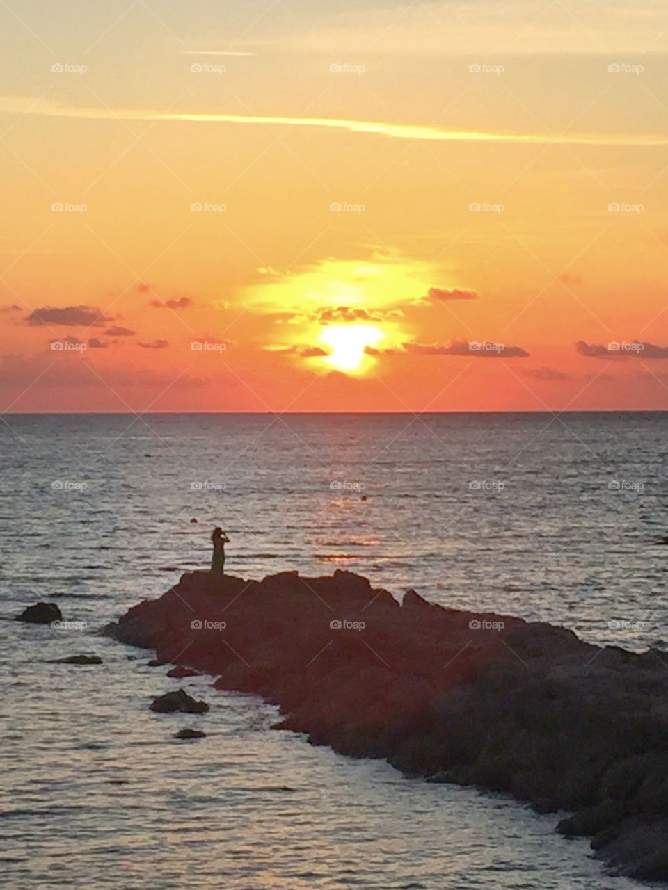 Standing by the sea , watching the sunset and a sky full of colors, listening to the sound of silence. The simple things make life is so beautiful.