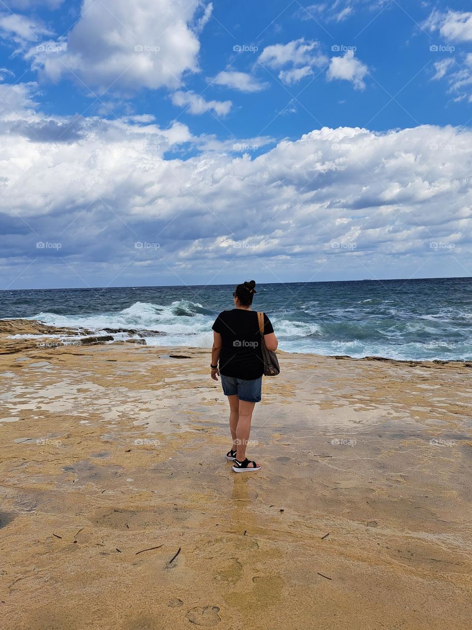 Lady looking at the sea