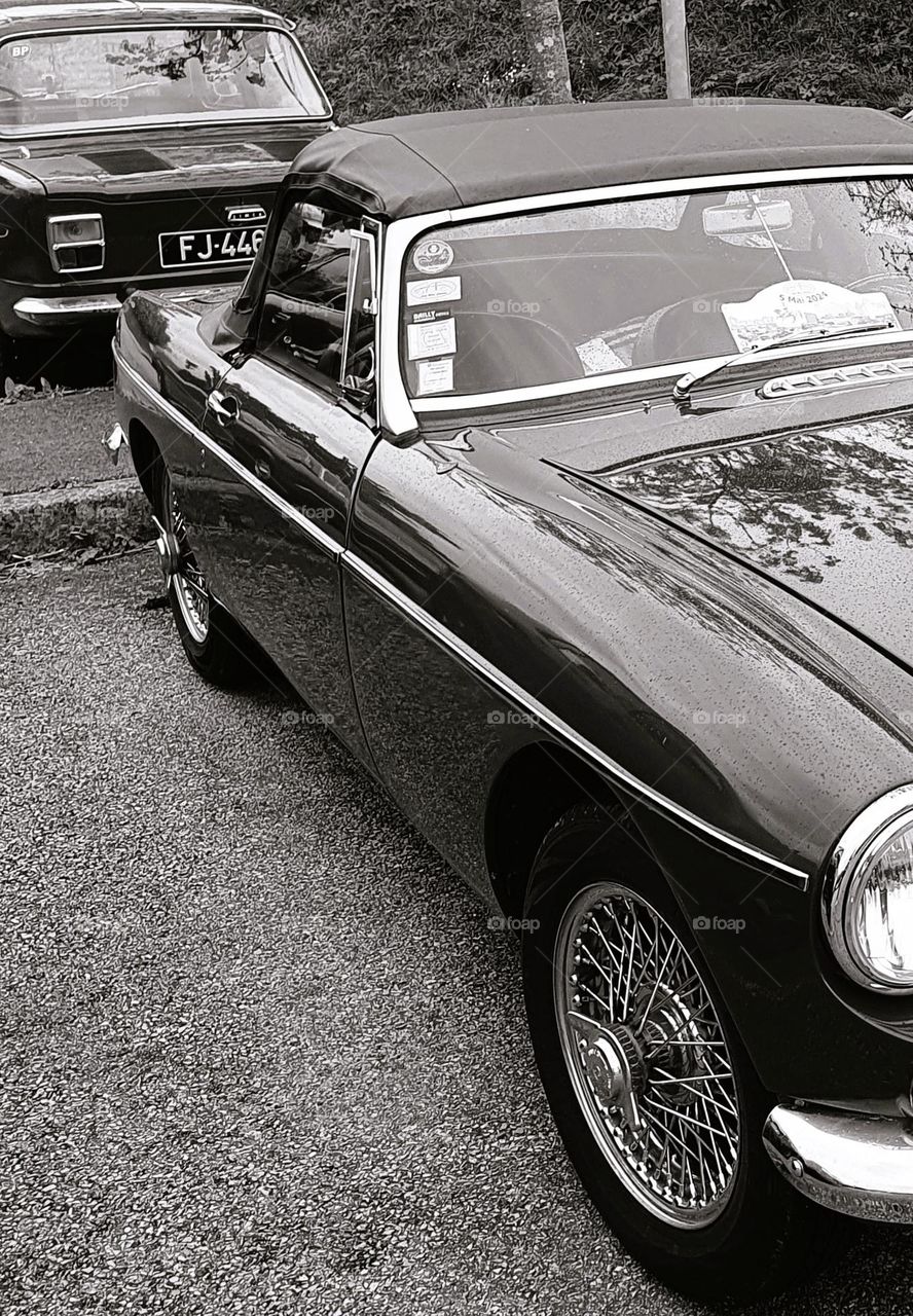 Sepia shot of the side of a MG MGB at Cherbourg car show