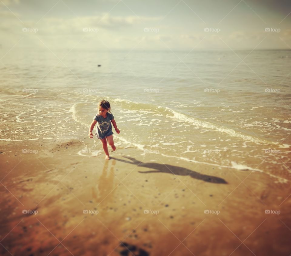 Girl playing at beach