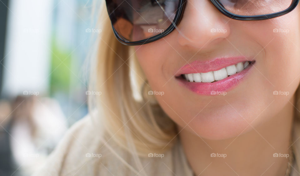 Extreme close-up of a beautiful smiling woman