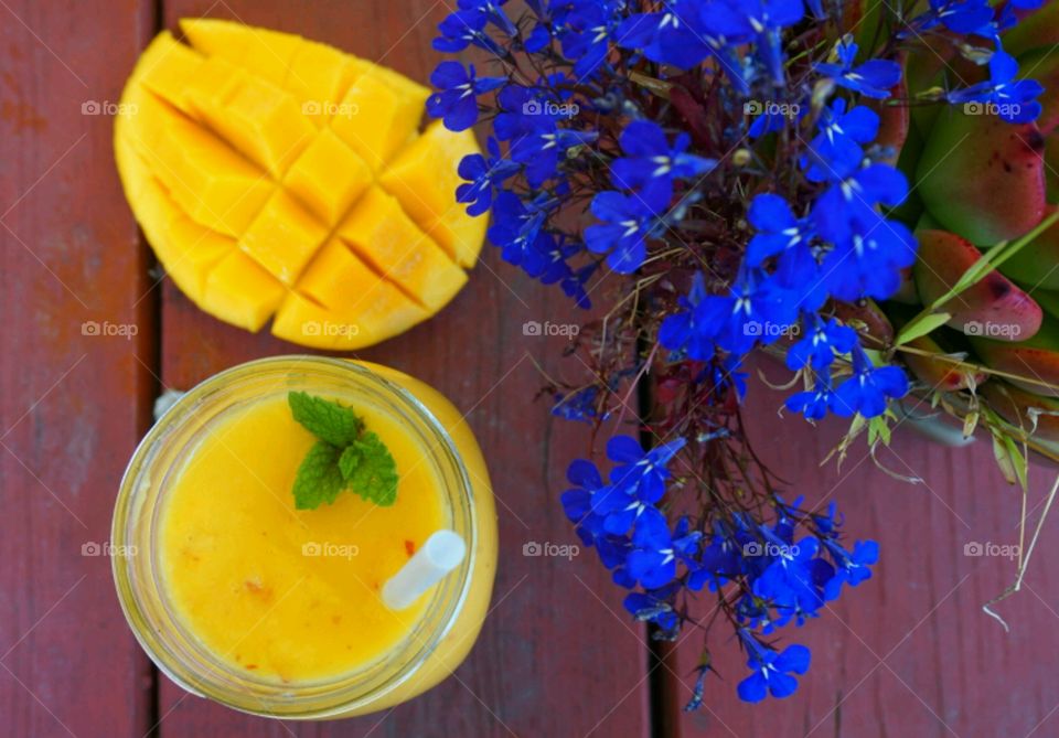 Fresh Fruit Smoothie - Mango and apple smoothie  topped mints , blueberry and raspberry