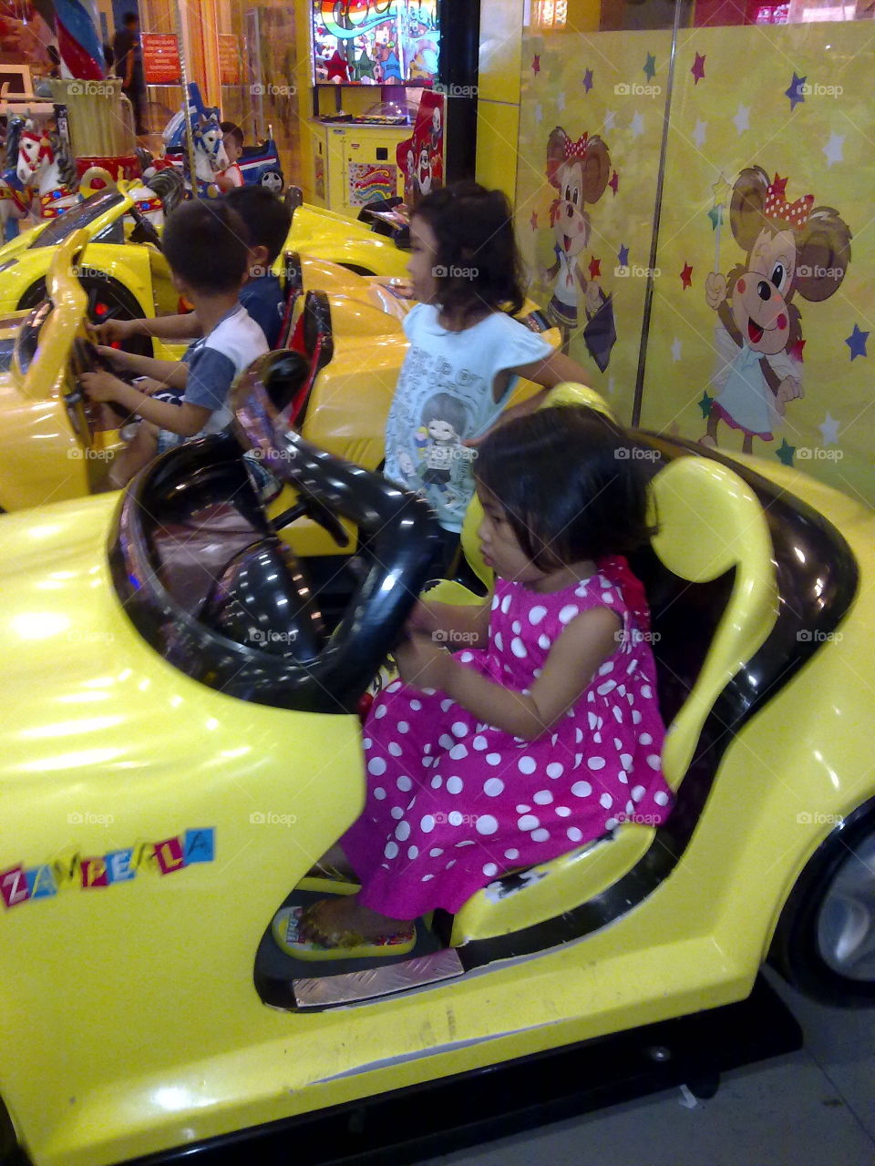 kids on toy ride