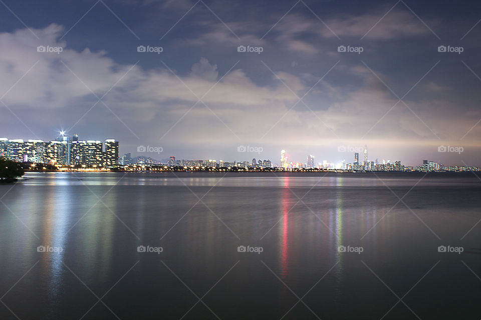 Long exposure city and sea