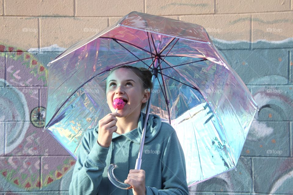 Girl holding Iridescent umbrella