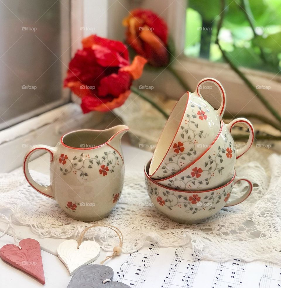 Vintage porcelain set cream cups and creamer with cozy floral pattern