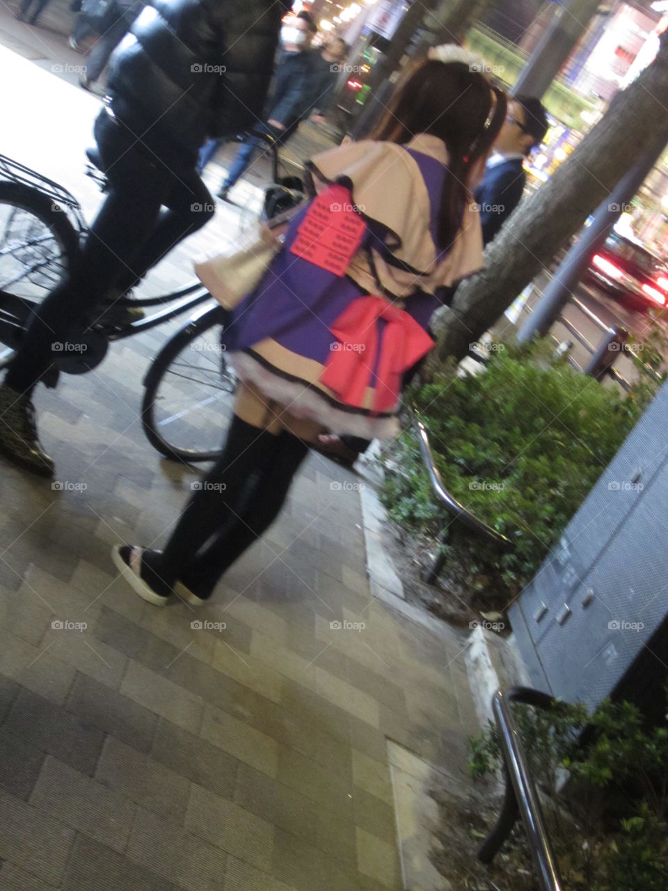 Akihabara, Tokyo, Japan.  Maid from Cafe Handing Out Flyers