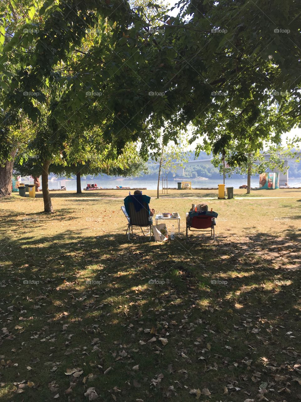 Couple in the shadow enjoying last summer days